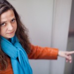 Woman on elevator with leather jacket